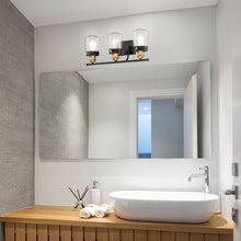 Load image into Gallery viewer, Macauley Vanity Wall Light in bathroom.
