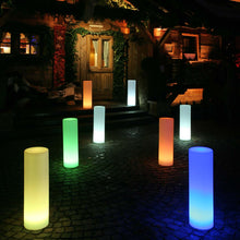 Load image into Gallery viewer, Tower LED Floor Lamp in Outside Area.
