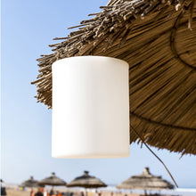 Load image into Gallery viewer, Tower LED Table Lamp in Outside Area.
