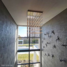 Load image into Gallery viewer, Constellation® Cosmic Cube LED Pendant Light in living room.
