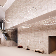 Load image into Gallery viewer, Constellation® Galaxy Matrix Round LED Pendant Light in living room.

