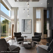Load image into Gallery viewer, Liquid Tri-Spreader LED Pendant Light in living room.
