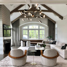 Load image into Gallery viewer, Papillons™ Swag LED Pendant Light in living room.
