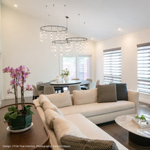 Load image into Gallery viewer, Suspenders® Ring LED Pendant Light in living room.
