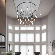 Load image into Gallery viewer, Suspenders® Ring LED Pendant Light in living room.
