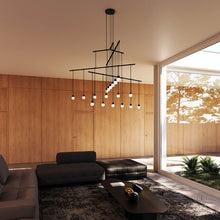 Load image into Gallery viewer, Suspenders® 4-Tier Tri-Bar LED Pendant Light in living room.
