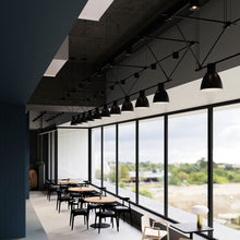 Load image into Gallery viewer, Suspenders® Triangle Truss Linear LED Suspension Light in restaurant.
