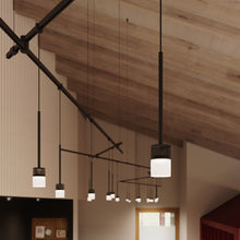 Load image into Gallery viewer, Suspenders® Zig Zag LED Pendant Light with Crystal Cylinder Luminaires in living room.
