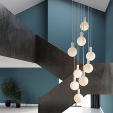 Load image into Gallery viewer, Alumina Sphere V LED Multi Light Pendant Light in living room.
