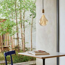 Load image into Gallery viewer, Cylindrical Pendant Light in living room.
