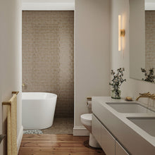 Load image into Gallery viewer, Kilter Wall Light in bathroom.
