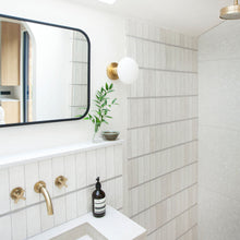 Load image into Gallery viewer, Lochan Oval Outdoor Wall Light in bathroom.
