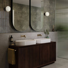 Load image into Gallery viewer, Lochan Oval Outdoor Wall Light in bathroom.
