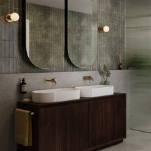Load image into Gallery viewer, Lochan Sphere III Outdoor Wall Light in bathroom.
