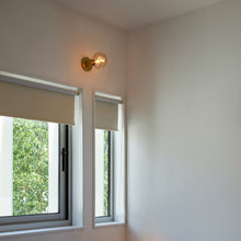 Load image into Gallery viewer, Lochan Wall Light in living room.
