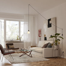 Load image into Gallery viewer, Noma Plug-In Pendant Light in living room.

