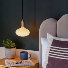 Load image into Gallery viewer, Oval Plug-In Pendant Light in bedroom.
