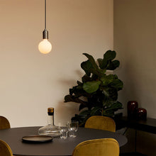 Load image into Gallery viewer, Sphere III Medium Base G31 Type LED Bulb in living room.
