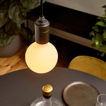 Load image into Gallery viewer, Sphere III Medium Base G31 Type LED Bulb in living room.

