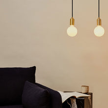 Load image into Gallery viewer, Sphere III Medium Base G31 Type LED Bulb in living room.
