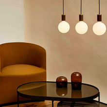 Load image into Gallery viewer, Sphere IV Medium Base G47 Type LED Bulb in living room.
