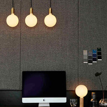 Load image into Gallery viewer, Sphere IV Pendant Light in living room.
