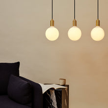 Load image into Gallery viewer, Sphere IV Pendant Light in living room.
