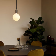 Load image into Gallery viewer, Sphere IV Pendant Light in living room.
