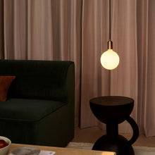 Load image into Gallery viewer, Sphere IV Plug-In Pendant Light in living room.
