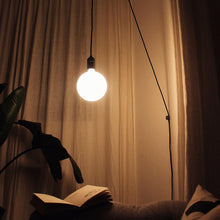 Load image into Gallery viewer, Sphere IV Plug-In Pendant Light in living room.
