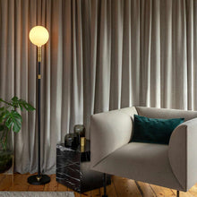 Load image into Gallery viewer, Sphere V Medium Base G63 Type LED Bulb in living room.
