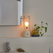 Load image into Gallery viewer, The Muse LED Portable Table Lamp in bathroom.

