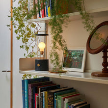 Load image into Gallery viewer, The Muse LED Portable Table Lamp in living room.
