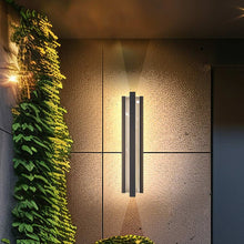 Load image into Gallery viewer, Hvar Outdoor LED Wall Light in Outside Area.
