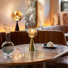 Load image into Gallery viewer, Melt LED Portable Table Lamp in living room.
