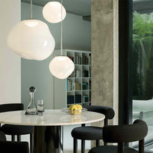 Load image into Gallery viewer, Melt Trio Round LED Pendant Light in living room.
