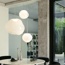 Load image into Gallery viewer, Melt Trio Round LED Pendant Light in living room.
