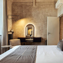 Load image into Gallery viewer, Gordon 2-Light Orientable Wall Light in bedroom.
