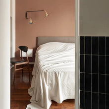Load image into Gallery viewer, Gordon 2-Light Orientable Wall Light in bedroom.
