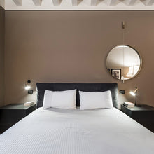 Load image into Gallery viewer, Gordon Recessed Wall Light in bedroom.

