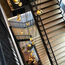 Load image into Gallery viewer, Muse Multi Light Pendant Light in stair way.
