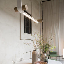 Load image into Gallery viewer, Nastro LED Pendant Light in Outside Area.
