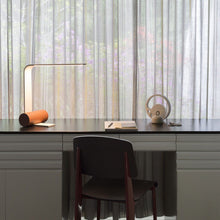 Load image into Gallery viewer, Nastro Open LED Table Lamp in living room.
