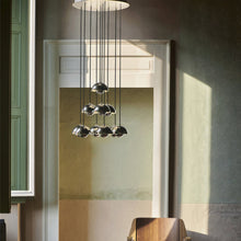 Load image into Gallery viewer, Flowerpot VP1 Chandelier in living room.
