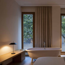 Load image into Gallery viewer, Mayfair LED Table Lamp in bedroom.
