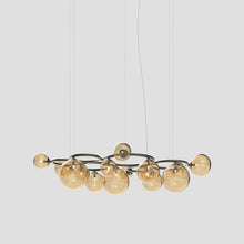 Load image into Gallery viewer, Puppet Ring Pendant Light in Matt Black Nickel/Amber Transparent(72-Inch/15-Light).
