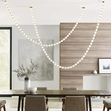 Load image into Gallery viewer, Collier LED Chandelier in dining room.
