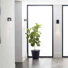 Load image into Gallery viewer, Kulma LED Wall Light in living room.
