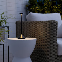 Load image into Gallery viewer, Moneta LED Table Lamp in Outside Area.
