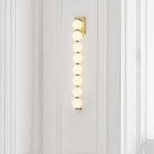 Load image into Gallery viewer, Perle LED Wall Light in living room.
